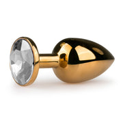 Goudkleurige metalen buttplug met transparant steen